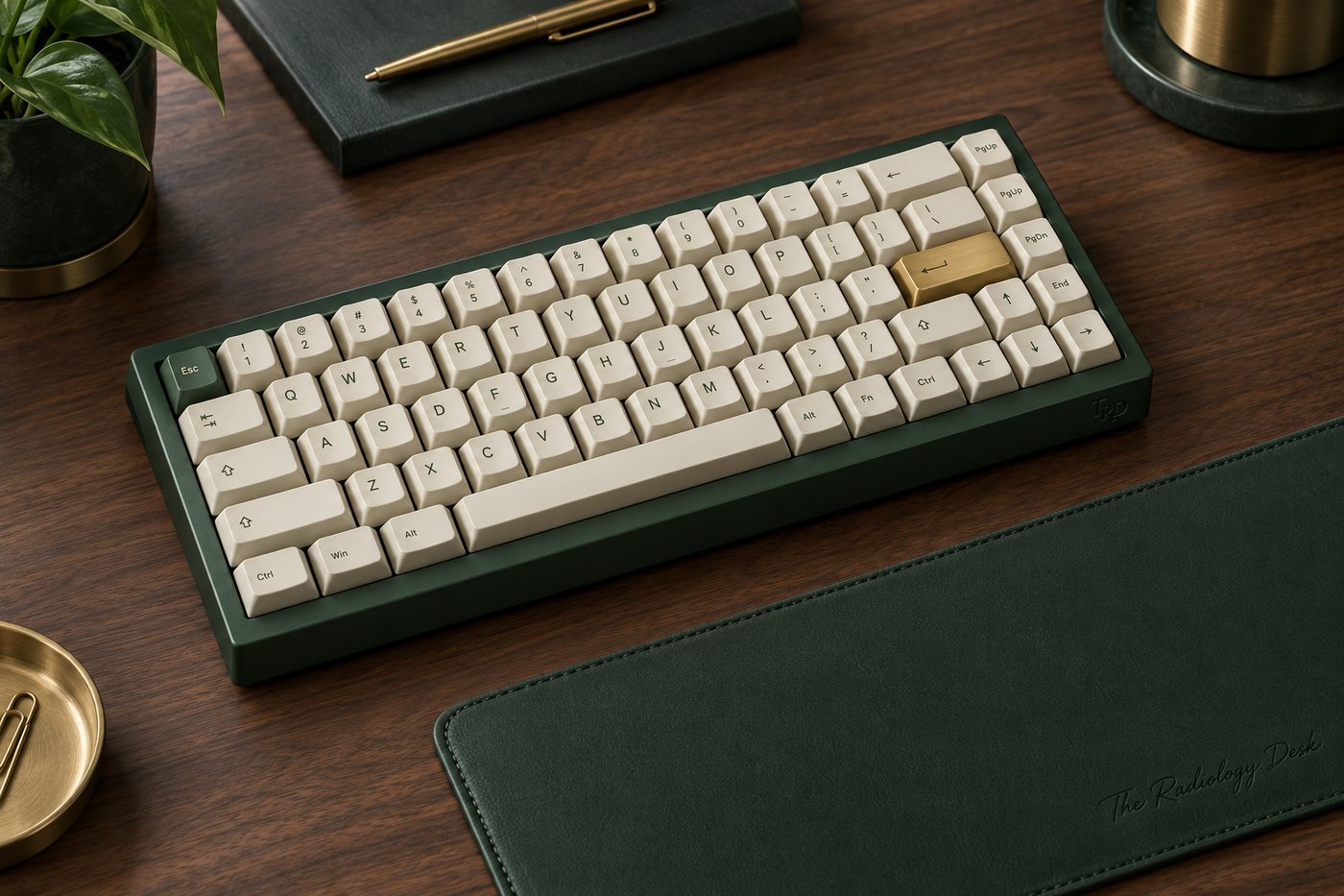 A forest green keyboard with cream keys and a leather desk mat